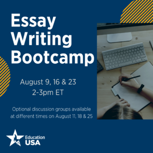 A hand writes in a notedbook next to a computer screen